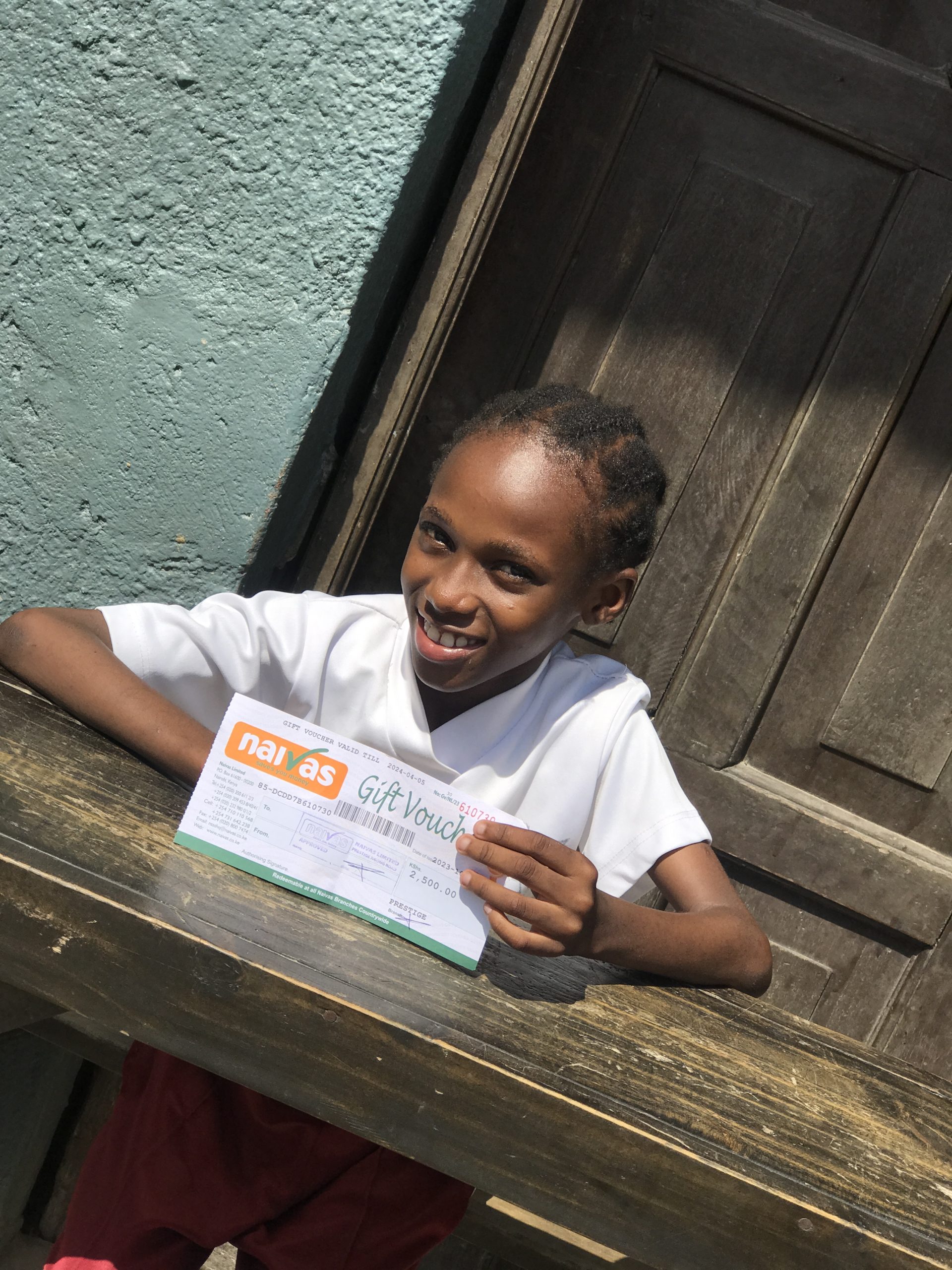 child receives gift shopping voucher