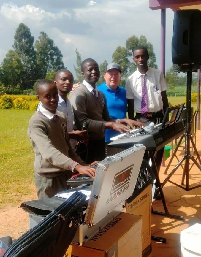 Dr. Buconyori Boys enjoying the instruments