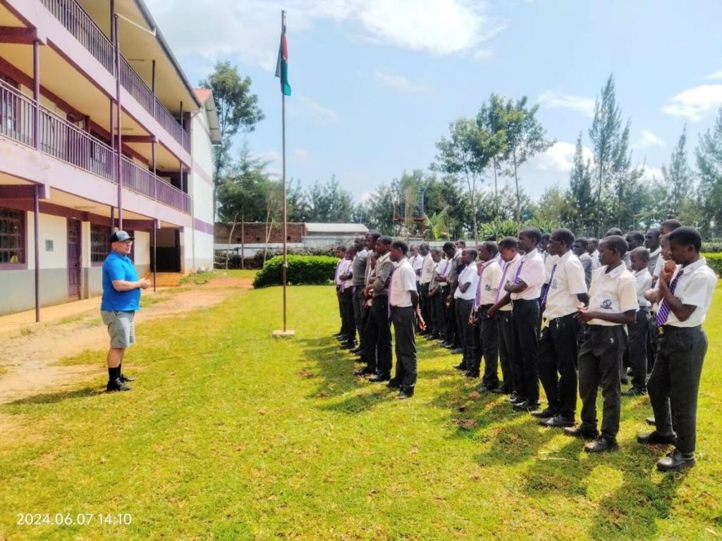 Rev Hamilton with the students on parade grounds