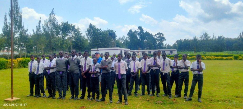 Rev Hamilton with the students on parade grounds